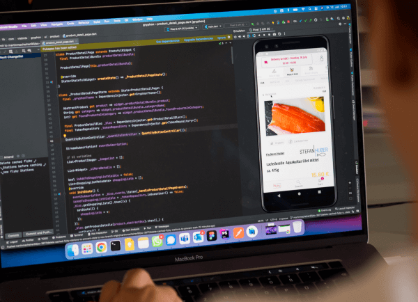 app code in coding environment with preview of a fish product
